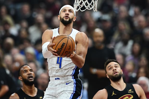 Orlando Magic guard Jalen Suggs attempts a layup during an NBA playoff game versus the Cleveland Cavaliers
