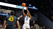 Washington Huskies forward Bryson Tucker (8) scores a basket against Baylor Bears guard Tounde Yessoufou (24) during the first half at Paul and Alejandra Foster Pavilion