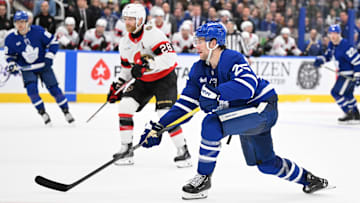 Mar 15, 2025; Toronto, Ontario, CAN;  Toronto Maple Leafs defenseman Brandon Carlo (25) shoots the puck against the Ottawa Senators in the third period at Scotiabank Arena. Mandatory Credit: Dan Hamilton-Imagn Images