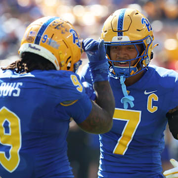 Oct 4, 2025; Pittsburgh, Pennsylvania, USA;  Pittsburgh Panthers linebacker Kyle Louis (9) celebrates his fumble recovery with defensive back Javon McIntyre (7) against the Boston College Eagles during the second quarter at Acrisure Stadium. Mandatory Credit: Charles LeClaire-Imagn Images