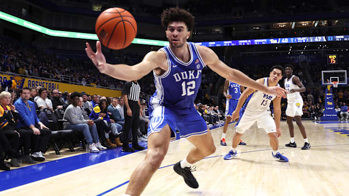 Feb 10, 2026; Pittsburgh, Pennsylvania, USA;  Duke Blue Devils forward Cameron Boozer (12) grabs a loose ball against the Pittsburgh Panthers during the second half.