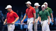 Tiger Woods, center, and Tom Kim, left, of Jupiter Links GC enjoy their match against Keegan Bradley, Rory McIlroy and Adam Scott of Boston Common during a TGL match against Boston Common at the SoFi Center on January 27, 2025, in Palm Beach Gardens, Florida.