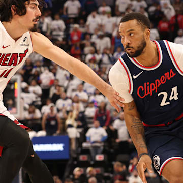 Jan 13, 2025; Inglewood, California, USA; LA Clippers guard Norman Powell (24) drives against Miami Heat guard Jaime Jaquez Jr. (11) during the second quarter at Intuit Dome. Mandatory Credit: Jason Parkhurst-Imagn Images