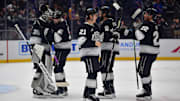 Mar 25, 2025; Los Angeles, California, USA; Los Angeles Kings goaltender Darcy Kuemper (35) center Trevor Lewis (61) defenseman Jordan Spence (21) defenseman Drew Doughty (8) and left wing Kevin Fiala (22) celebrate the victory against the New York Rangers at Crypto.com Arena. Mandatory Credit: Gary A. Vasquez-Imagn Images