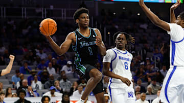 Mar 15, 2025; Fort Worth, TX, USA; Tulane Green Wave forward Kaleb Banks (1) passes the ball ahead of Memphis Tigers guard Baraka Okojie (6) during the first half at Dickies Arena. Mandatory Credit: Chris Jones-Imagn Images