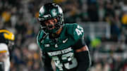Oct 25, 2025; East Lansing, Michigan, USA; Michigan State Spartans safety Malik Spencer (43) reacts after a third down defensive play against the Michigan Wolverines during the first half at Spartan Stadium.