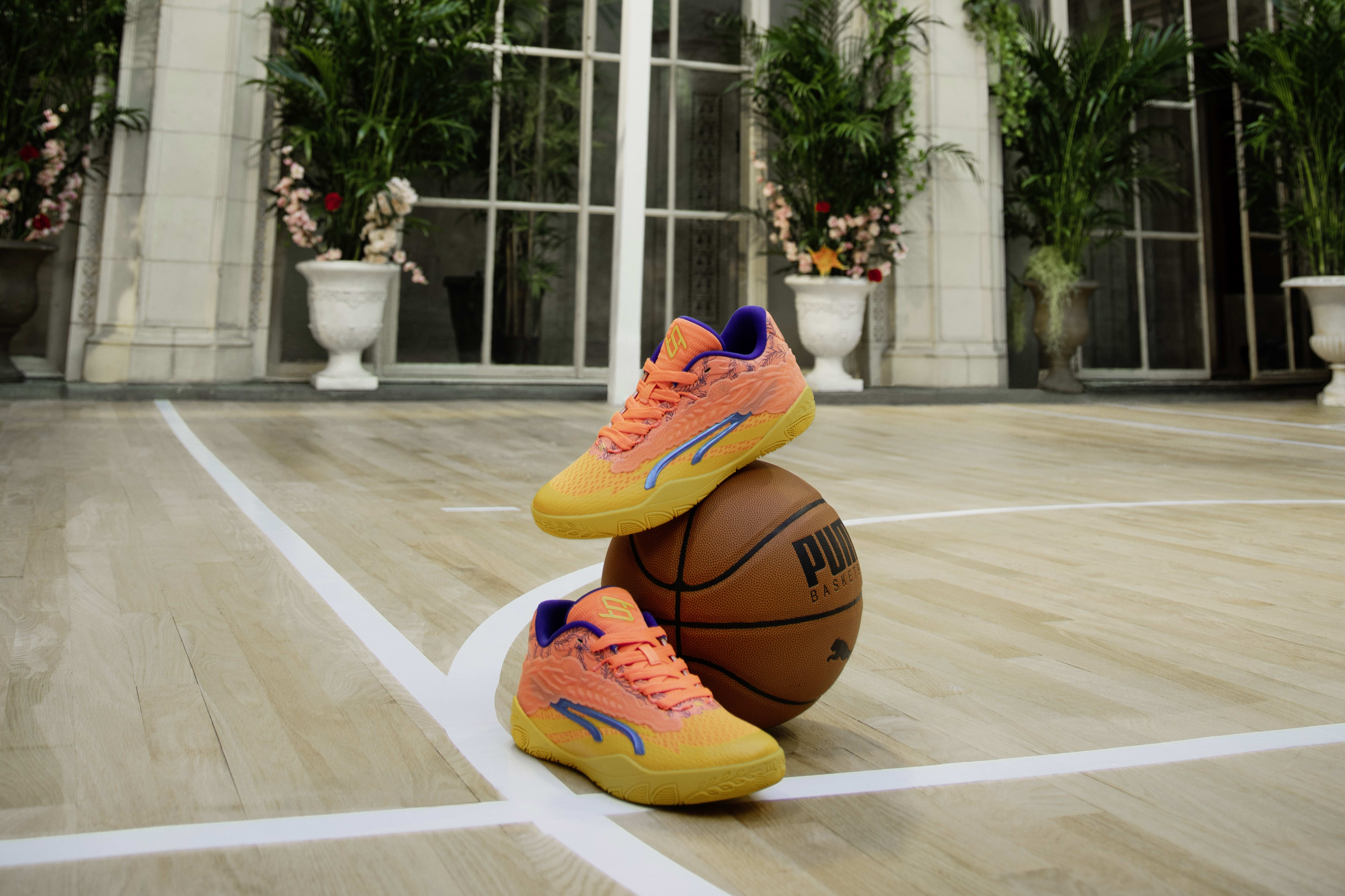 Side view of Breanna Stewart's orange and yellow PUMA sneakers.