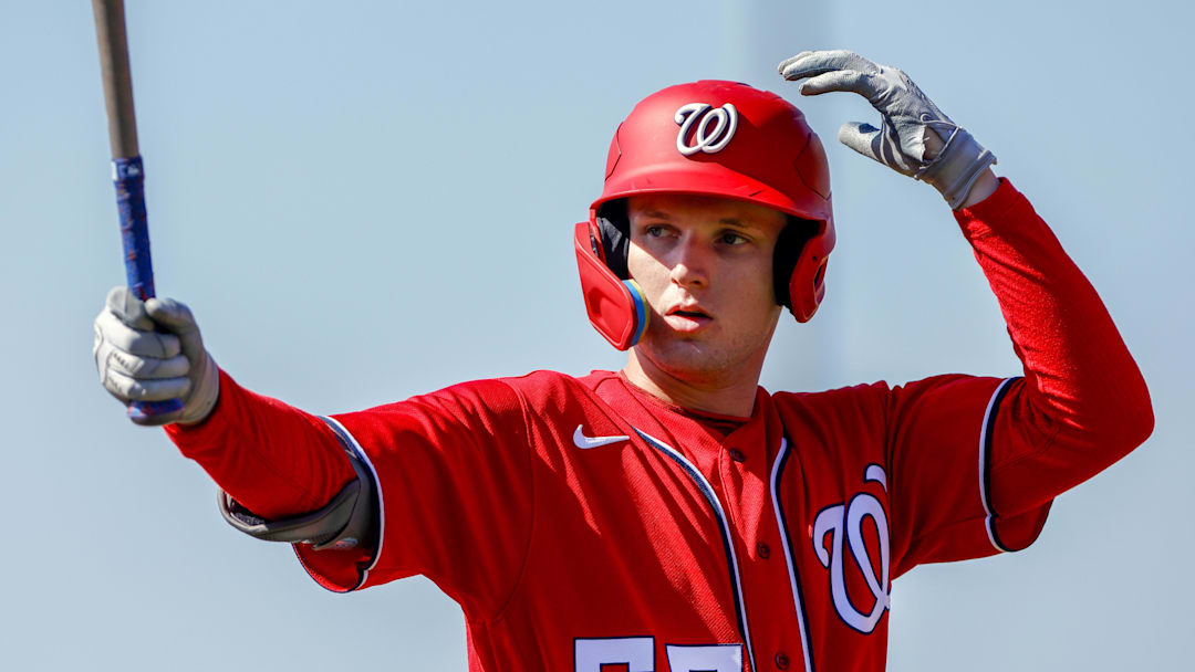 Feb 20, 2023; West Palm Beach, FL, USA; Washington Nationals outfielder Robert Hassell III (55) practices his swing during a spring training workout at The Ballpark of the Palm Beaches. 