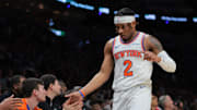 Mar 2, 2025; Miami, Florida, USA; New York Knicks guard Miles McBride (2) high-fives with teammates during the second quarter against the Miami Heat at Kaseya Center. Mandatory Credit: Sam Navarro-Imagn Images