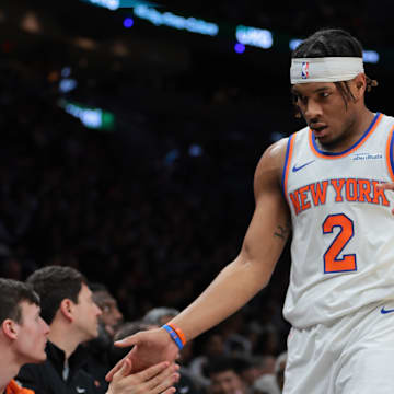 Mar 2, 2025; Miami, Florida, USA; New York Knicks guard Miles McBride (2) high-fives with teammates during the second quarter against the Miami Heat at Kaseya Center. Mandatory Credit: Sam Navarro-Imagn Images