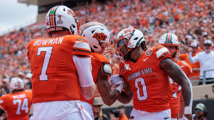 Aug 31, 2024; Stillwater, Oklahoma, USA; Oklahoma State Cowboys running back Ollie Gordon II (0) celebrates with teammates after a touchdown during the second quarter against the South Dakota State Jackrabbits at Boone Pickens Stadium. Mandatory Credit: William Purnell-USA TODAY Sports