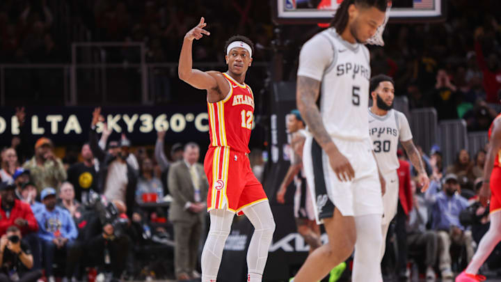 Feb 5, 2025; Atlanta, Georgia, USA; Atlanta Hawks forward De'Andre Hunter (12) reacts after a basket against the San Antonio Spurs in the third quarter at State Farm Arena. Mandatory Credit: Brett Davis-Imagn Images
