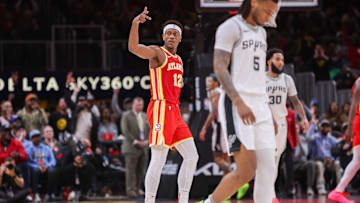 Feb 5, 2025; Atlanta, Georgia, USA; Atlanta Hawks forward De'Andre Hunter (12) reacts after a basket against the San Antonio Spurs in the third quarter at State Farm Arena. Mandatory Credit: Brett Davis-Imagn Images