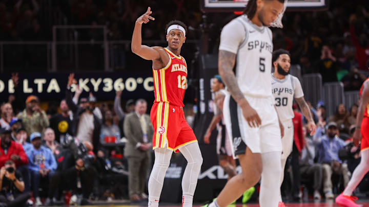 Feb 5, 2025; Atlanta, Georgia, USA; Atlanta Hawks forward De'Andre Hunter (12) reacts after a basket against the San Antonio Spurs in the third quarter at State Farm Arena. Mandatory Credit: Brett Davis-Imagn Images