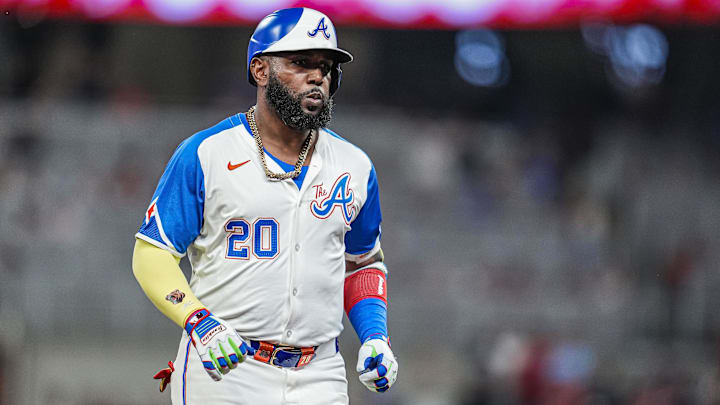 Aug 9, 2025; Cumberland, Georgia, USA; Atlanta Braves designated hitter Marcell Ozuna (20) reacts after hitting a home run against the Miami Marlins during the fifth inning at Truist Park. Mandatory Credit: Dale Zanine-Imagn Images