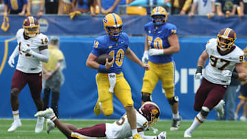 Sep 6, 2025; Pittsburgh, Pennsylvania, USA;  Pittsburgh Panthers quarterback Eli Holstein (10) runs with the ball against the Central Michigan Chippewas during the first quarter at Acrisure Stadium. Mandatory Credit: Charles LeClaire-Imagn Images