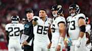 Nov 23, 2025; Glendale, Arizona, USA;  Jacksonville Jaguars tight end Brenton Strange (85) and Jacksonville Jaguars quarterback Trevor Lawrence (16) look on during the fourth quarter against the Arizona Cardinals at State Farm Stadium. Mandatory Credit: Mark J. Rebilas-Imagn Images