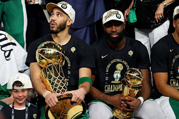 Jayson Tatum and Jaylen Brown of the NBA's Boston Celtics celebrate their 2024 NBA Finals victory.