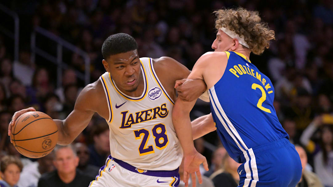 Oct 12, 2025; Los Angeles, California, USA;  Los Angeles Lakers forward Rui Hachimura (28) is defended by Golden State Warriors guard Brandin Podziemski (2) during the first half at Crypto.com Arena. Mandatory Credit: Jayne Kamin-Oncea-Imagn Images