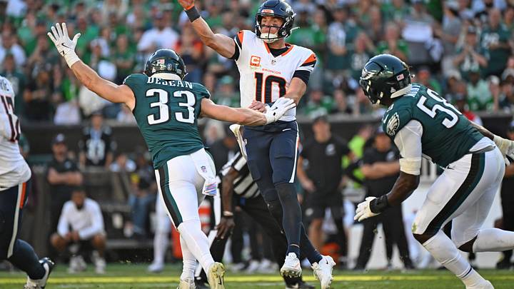 Oct 5, 2025; Philadelphia, Pennsylvania, USA; Denver Broncos quarterback Bo Nix (10) throws a pass order Philadelphia Eagles cornerback Cooper Dejean (33) during the fourth quarter at Lincoln Financial Field. Mandatory Credit: Eric Hartline-Imagn Images