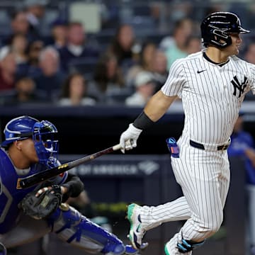 Sep 9, 2024; Bronx, New York, USA; New York Yankees center fielder Jasson Dominguez (89) follows through on a single against the Kansas City Royals during the fourth inning at Yankee Stadium. Mandatory Credit: Brad Penner-Imagn Images