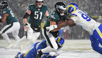 Jan 19, 2025; Philadelphia, Pennsylvania, USA; Philadelphia Eagles quarterback Jalen Hurts (1) is sacked  by Los Angeles Rams defensive tackle Neville Gallimore (92) and Rams linebacker Keir Thomas (96) in the end zone for a safety during the third quarter in a 2025 NFC divisional round game at Lincoln Financial Field. Mandatory Credit: Eric Hartline-Imagn Images