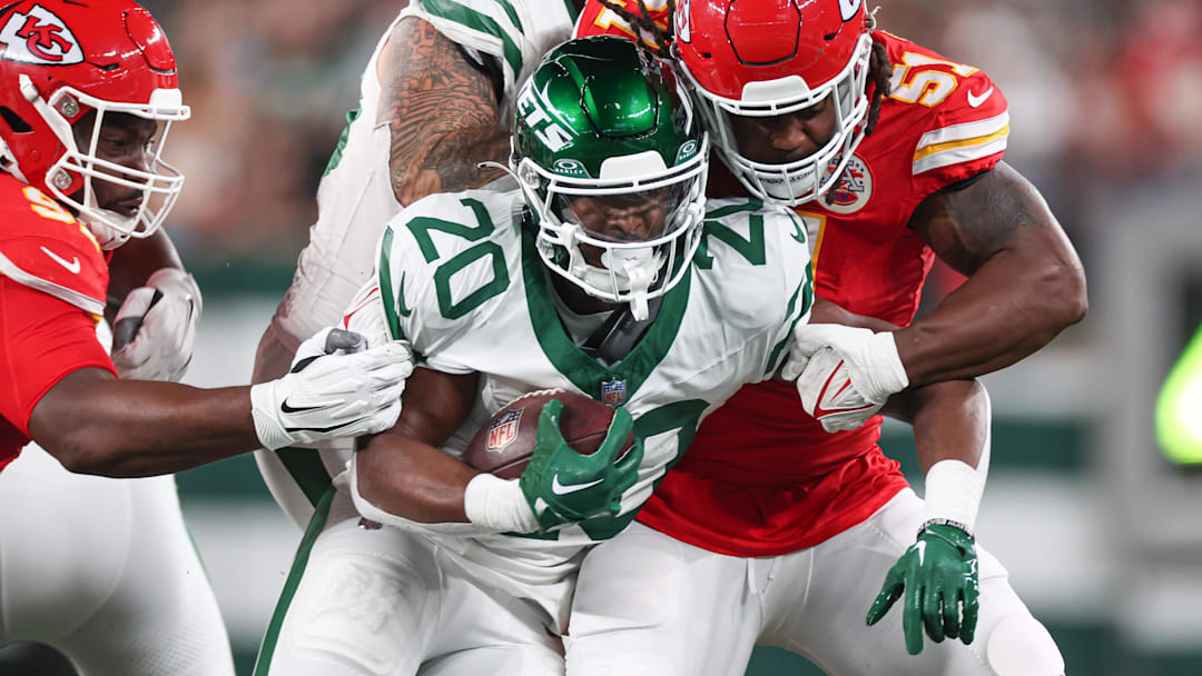 Oct 1, 2023; East Rutherford, New Jersey, USA; New York Jets running back Breece Hall (20) is tackled by Kansas City Chiefs defensive end Mike Danna (51) during the first half at MetLife Stadium. Oct 1, 2023; East Rutherford, New Jersey, USA; New York Jets running back Breece Hall (20) is tackled by Kansas City Chiefs defensive end Mike Danna (51) during the first half at MetLife Stadium.