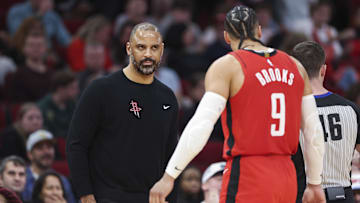 Dec 20, 2023; Houston, Texas, USA; Houston Rockets head coach Ime Udoka reacts with forward Dillon Brooks (9) during the second quarter against the Atlanta Hawks at Toyota Center. Mandatory Credit: Troy Taormina-Imagn Images