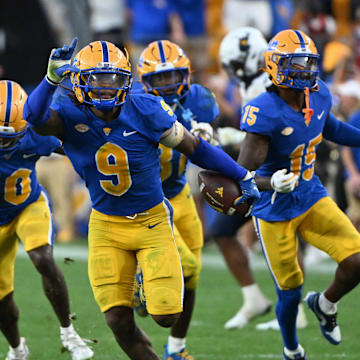 Sep 14, 2024; Pittsburgh, Pennsylvania, USA; Pittsburgh Panthers linebacker Kyle Louis celebrates after intercepting West Virginia Mountaineers quarterback Garrett Greene (6) in the fourth quarter at Acrisure Stadium. Mandatory Credit: Barry Reeger-Image Images