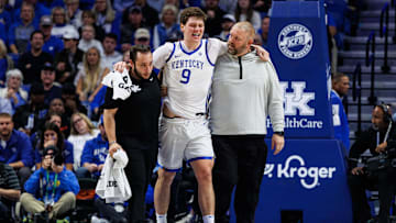 Nov 4, 2025; Lexington, Kentucky, USA; Kentucky Wildcats forward Trent Noah (9) is helped off the court during the first half against the Nicholls Colonels at Rupp Arena at Central Bank Center. Mandatory Credit: Jordan Prather-Imagn Images