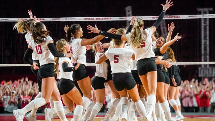 Aug 30, 2023; Lincoln, NE, USA; The Nebraska Cornhuskers celebrate after defeating the Omaha Mavericks in three sets at Memorial Stadium.