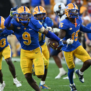 Sep 14, 2024; Pittsburgh, Pennsylvania, USA; Pittsburgh Panthers linebacker Kyle Louis celebrates after intercepting West Virginia Mountaineers quarterback Garrett Greene (6) in the fourth quarter at Acrisure Stadium. Mandatory Credit: Barry Reeger-Image Images