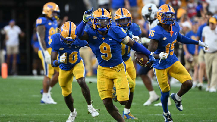 Sep 14, 2024; Pittsburgh, Pennsylvania, USA; Pittsburgh Panthers linebacker Kyle Louis celebrates after intercepting West Virginia Mountaineers quarterback Garrett Greene (6) in the fourth quarter at Acrisure Stadium. Mandatory Credit: Barry Reeger-Image Images