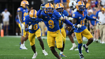 Sep 14, 2024; Pittsburgh, Pennsylvania, USA; Pittsburgh Panthers linebacker Kyle Louis celebrates after intercepting West Virginia Mountaineers quarterback Garrett Greene (6) in the fourth quarter at Acrisure Stadium. Mandatory Credit: Barry Reeger-Image Images