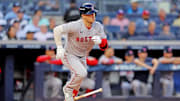 Sep 30, 2025; Bronx, New York, USA; Boston Red Sox third base Alex Bregman (2) hits a single during the first inning against the New York Yankees during game one of the Wildcard round for the 2025 MLB playoffs at Yankee Stadium. Mandatory Credit: Brad Penner-Imagn Images