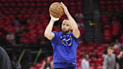 Golden State Warriors guard Stephen Curry wears a bandage on his thumb while practicing before game two.