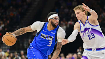 Oct 13, 2025; Salt Lake City, Utah, USA; Dallas Mavericks forward/center Anthony Davis (3) drives to the basket into Utah Jazz forward/center Lauri Markkanen (23) during the second quarter at Delta Center. Mandatory Credit: Peter Creveling-Imagn Images