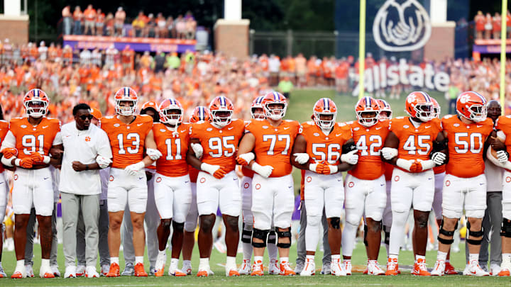 Clemson players and coaches lock arms at LSU v Clemson game 