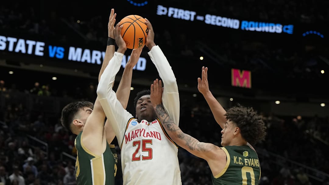 Mar 23, 2025; Seattle, WA, USA; Maryland Terrapins center Derik Queen (25) drives to the basket against Colorado State Rams forward Kyle Jorgensen (35) and guard Kyan Evans (0) in the second half at Climate Pledge Arena. Stephen Brashear-Imagn Images