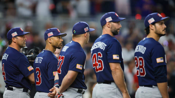 Mar 21, 2023; Miami, Florida, USA; USA right fielder Mookie Betts (3) listens to the national anthem prior to the game against Japan at LoanDepot Park.