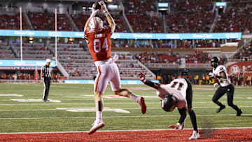 Aug 29, 2024; Salt Lake City, Utah, USA; Utah Utes tight end Caleb Lohner (84) jumps for a pass against Southern Utah Thunderbirds safety Brendan Hale (11) during the third quarter at Rice-Eccles Stadium. Mandatory Credit: Rob Gray-Imagn Images