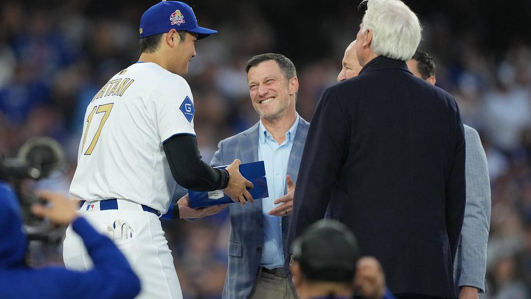 Mar 28, 2025; Los Angeles, California, USA;  President of Baseball Operations for the Los Angeles Dodgers Andrew Friedman congratulates pitcher Shohei Ohtani (17) during the ring ceremony prior to the game against the Detroit Tigers at Dodger Stadium. Mandatory Credit: Kirby Lee-Imagn Images