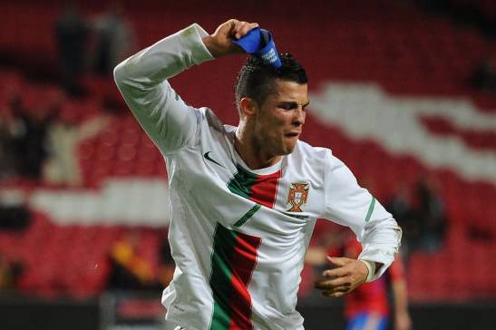 Cristiano Ronaldo tossing his armband on the ground.