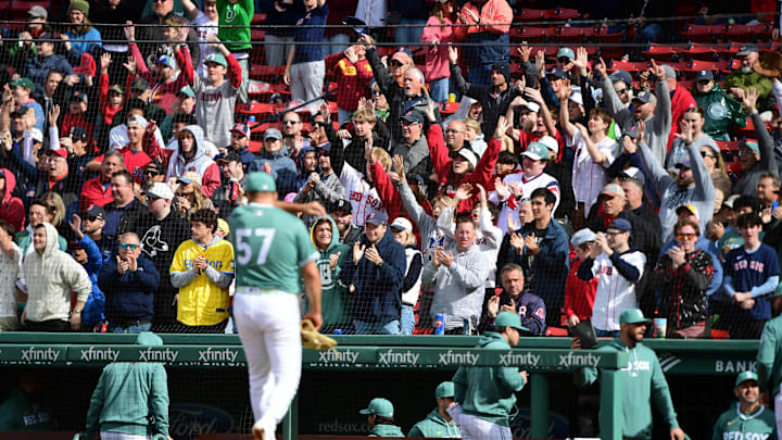 Boston, Massachusetts, USA; Boston Red Sox fans cheer after relief pitcher Greg Weissert (57) pitches during the tenth inning against the Baltimore Orioles at Fenway Park. Boston, Massachusetts, USA; Boston Red Sox fans cheer after relief pitcher Greg Weissert (57) pitches during the tenth inning against the Baltimore Orioles at Fenway Park.