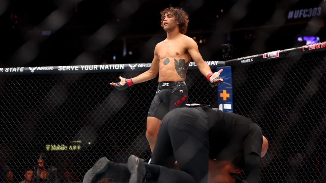 Jun 29, 2024; Las Vegas, Nevada, USA; Payton Talbott (red gloves) reacts after knocking out Yanis Ghemmouri (blue gloves) during UFC 303 at T-Mobile Arena. Mandatory Credit: Mark J. Rebilas-USA TODAY Sports