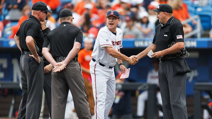 Jun 1, 2024; Lexington, KY, USA; Illinois Fighting Illini head coach Dan Hartleb shakes hands with the umpires before the game against the Kentucky Wildcats at Kentucky Proud Park. Mandatory Credit: Jordan Prather-Imagn Images