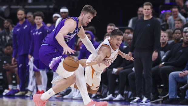 Oct 27, 2025; Salt Lake City, Utah, USA; Utah Jazz forward Kyle Filipowski (22)(left) and Phoenix Suns guard Grayson Allen (8