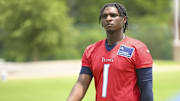 Jun 10, 2025; Nashville, TN, USA; Tennessee Titans quarterback Cam Ward (1) walks off the field during minicamp at Nissan Stadium.