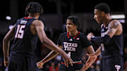 Jan 21, 2025; Cincinnati, Ohio, USA; Texas Tech Red Raiders forward JT Toppin (15) reacts after a play with guard Christian Anderson (4) and guard Chance McMillian (0) in the second half against the Cincinnati Bearcats at Fifth Third Arena.