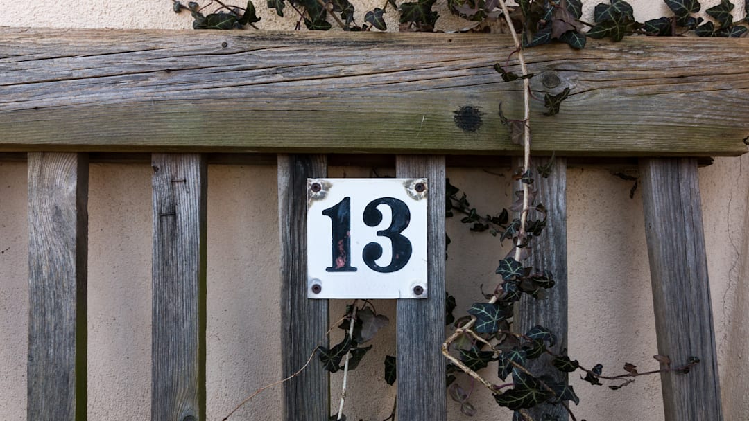 Number 13 on a sign on a door